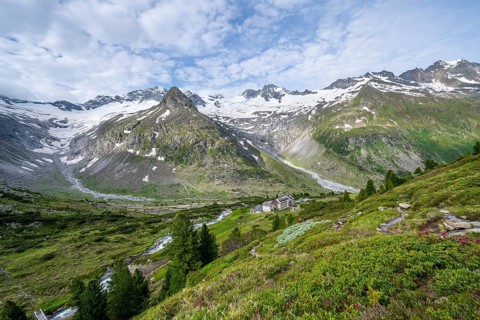 Picturesque mountain landscape, mountain hut Berliner Huette, mountain summit Steinmandl, summit