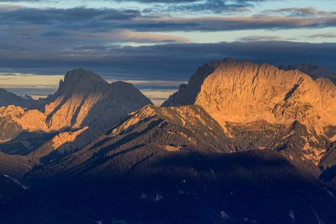 Distant view of steep mountains in the evening light, clouds, autumn, view from Wank to Karwendel