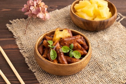 Tteokbokki or Topokki, fried rice cake stick, popular Korean street food with spicy jjajang sauce