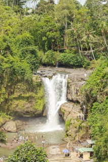 Tegenungan waterfall, Bali island, Ubud, Indonesia. Jungle, tropical forest, daytime with cloudy