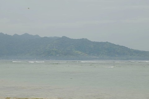Lombok and Gili Air islands, overcast, cloudy day, sky and sea. Vacation, travel, tropics concept,