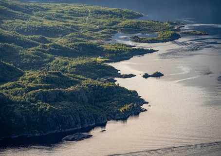Coast with small house, Raftsund fjord, view from the top of Dronningsvarden or Stortinden,