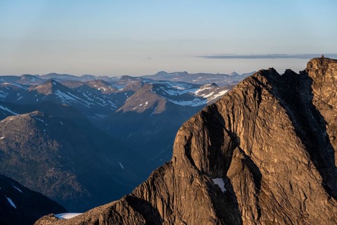 Mountain peak in soft evening light, view from the summit of Skala at sunset, Loen, Norway, Europe