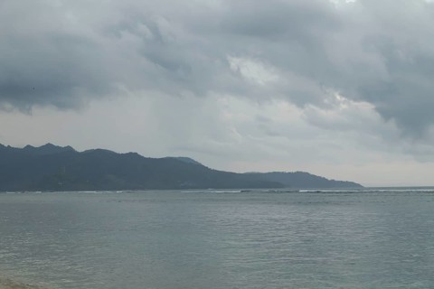 Lombok and Gili Air islands, overcast, cloudy day, sky and sea. Vacation, travel, tropics concept,
