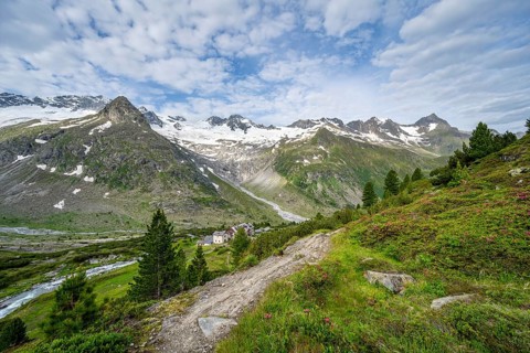 Picturesque mountain landscape with hiking trail, mountain hut Berliner Huette, mountain peak