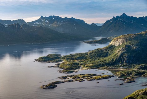 Fjord Raftsund and mountains in atmospheric evening light, view from the summit of Dronningsvarden
