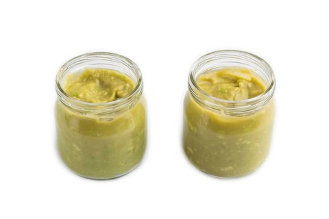 Baby puree with vegetable mix, broccoli, tomatoes, cucumber, avocado infant formula in glass jar