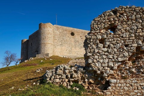 The ruins of an ancient castle, inner castle with a clear blue sky in the background, Chlemoutsi,