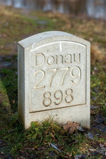 Marker stone at the confluence of the Breg and Brigach rivers to form the Danube, source of the