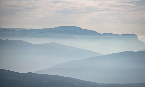Mountain silhouettes in the evening light, view from the summit of Skala, Loen, Norway, Europe