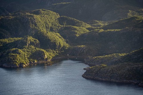 Coast in atmospheric evening light, view from the top of Dronningsvarden or Stortinden,