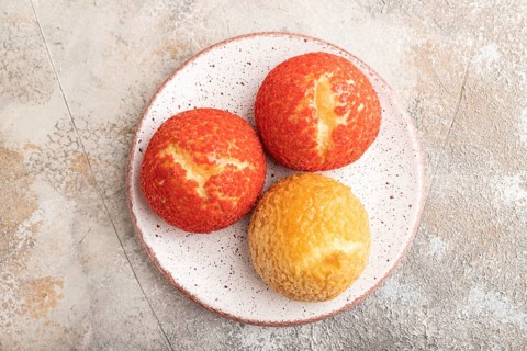 Traditional french custard dessert shu cake on brown concrete background. top view, flat lay, close