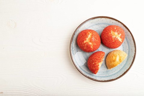 Traditional french custard dessert shu cake on white wooden background. top view, flat lay, copy