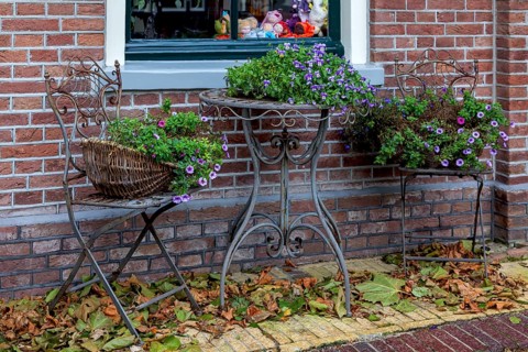 Flower decoration in front of a house, Oosterend, North Sea island Texel, North Holland,