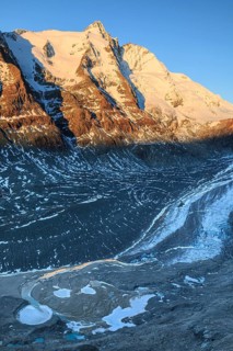 Glacier tongue and snow-covered mountain peak at sunrise, Grossglockner and Pasterze, autumn, Hohe