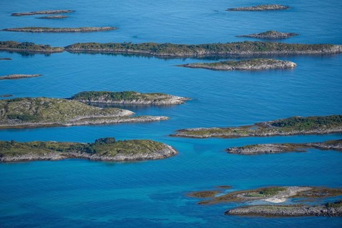Rocky islands in the blue sea, Sea with archipelago islands, Vesteralen, Norway, Europe