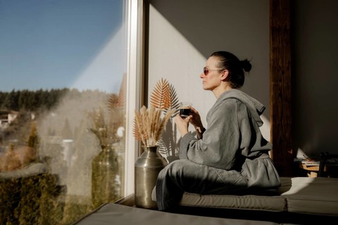 Woman enjoying coffee at a wellness centre