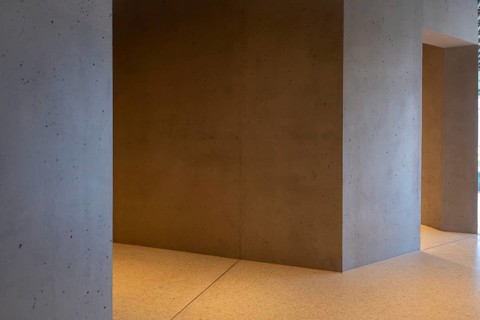 Modern Illuminated Concrete Corridor in a Sunny Day in Switzerland