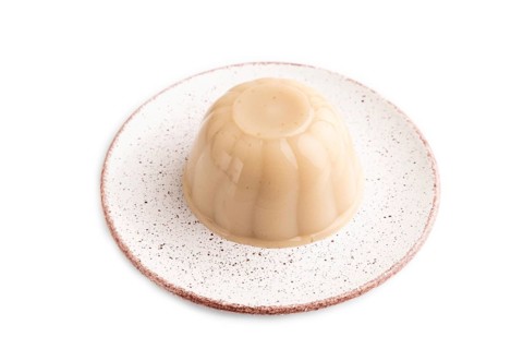 Buckwheat milk jelly isolated on white background. side view