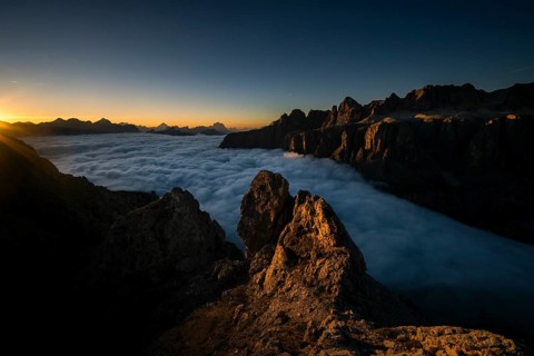 Sunrise over a sea of fog and Dolomite peaks in the background, Corvara, Dolomites, Italy, Europe