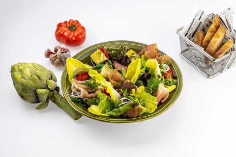 Food photography Various salads with artichokes and Serrano ham