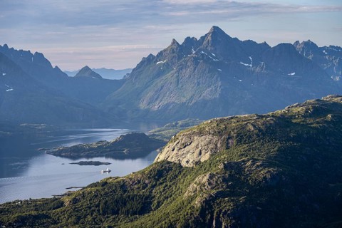 Fjord Raftsund and mountains in atmospheric evening light, view from the summit of Dronningsvarden