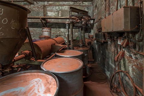Bronze powder production room with filling bins in a metal powder mill, founded around 1900,
