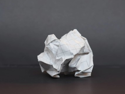 White paper ball over dark gray background