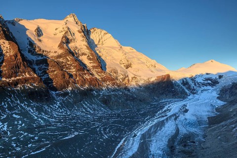 Glacier tongue and snow-covered mountain peak at sunrise, Grossglockner and Pasterze, autumn, Hohe