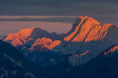 Distant view of steep mountains in the evening light, clouds, autumn, view from Wank to Karwendel