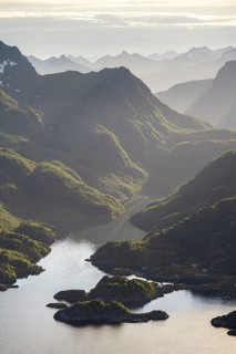 Fjord landscape with atmospheric evening light, Ulvagfjorden fjord and mountains, view from the top