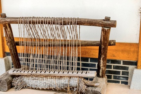 Old fashioned Korean hand loom used to make traditional straw beds in ancient Korea