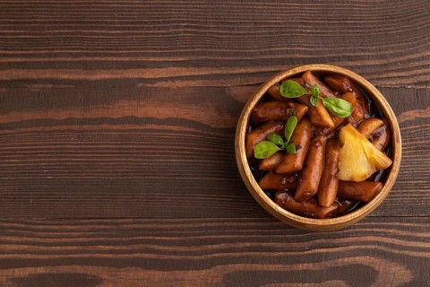 Tteokbokki or Topokki, fried rice cake stick, popular Korean street food with spicy jjajang sauce