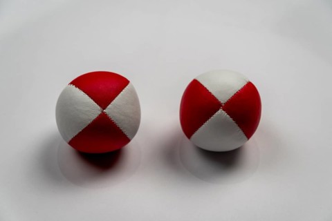 Two juggling balls in front of a white background, studio shot, Germany, Europe