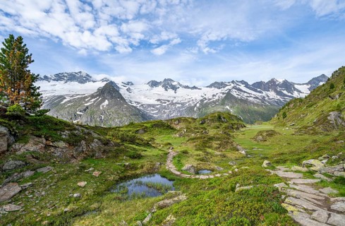 Hiking trail in picturesque mountain landscape, mountain peaks with snow and glacier Hornkees and