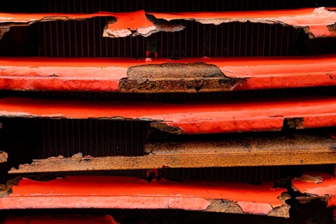 Rusty red lorry radiator, abandoned herring factory Djupavik, Reykjarfjoerour, Strandir, Arnes,