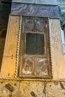 Plaque of Poseidon trident and dolphins on column wall inside Hagia Sophia Mosque in Istanbul,