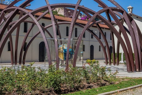 Earth sphere made in early 19th century under arched structure in front of museum in Istanbul,