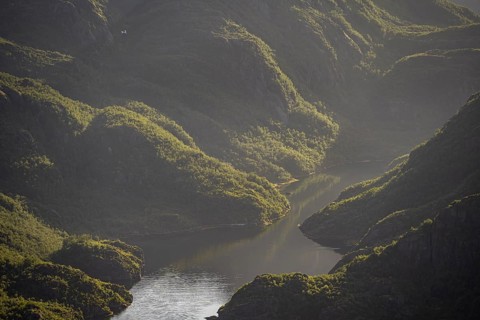 Fjord landscape with atmospheric evening light, Ulvagfjorden fjord and mountains, view from the top