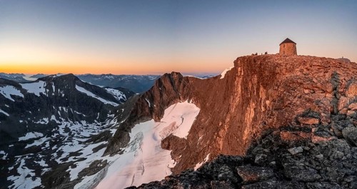 Summit of Skala with DNT's Skalatarnet mountain hut, at sunset, Loen, Norway, Europe
