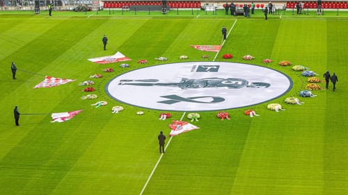Flags of the FC Bayern fan clubs lie on the pitch in honour of Franz Beckenbauer, banner with Franz