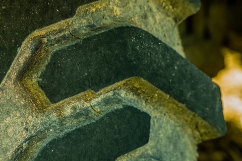 Closeup of tire tread of industrial heavy equipment roadwork machine