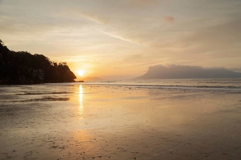 Bako national park, sea sandy beach, overcast, cloudy sunset, sky and sea, low tide. Vacation,