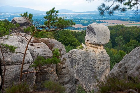 Nature view with imposing rocks and trees in front of a cloudy sky, Hruboskalske skalni mesto,