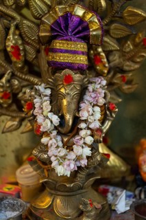 Hindu elephant god Ganesha adorned with a jasmine necklace, India, Asia
