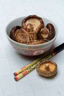 Dried shiitake mushrooms in a bowl, soaked in water