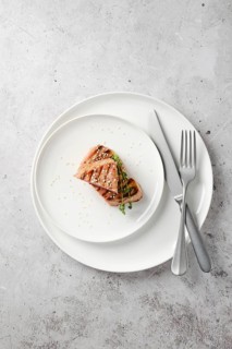 Portion of grilled ahi tuna steak on a plate