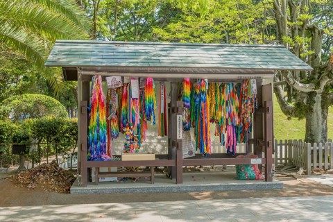 Origami steamers hanging in wooden shelter at Peace Memorial Park in Hiroshima, Japan, Asia
