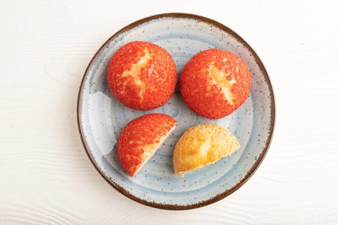 Traditional french custard dessert shu cake on white wooden background. top view, flat lay, close