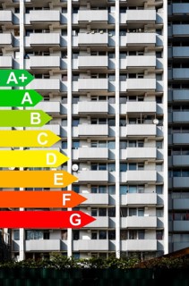 Facade of a high-rise building, graphic with energy efficiency classes for buildings according to